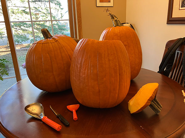 Carving plenty of pumpkins.