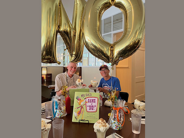 Celebrating Mr. Fox's Game of "NO!" with Mike Wohnoutka by enjoying giant hot fudge sundaes.