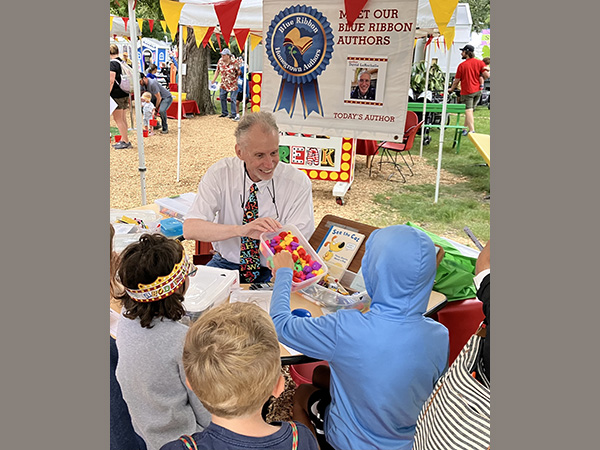 Helping kids win a rubber duck by playing "Go and Get!" at the Minnesota State Fair.