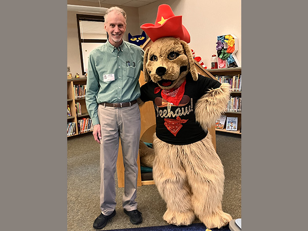 David LaRochelle and school mascot in Texas