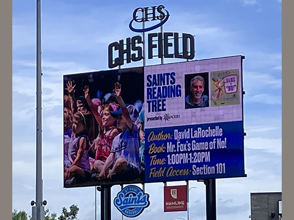 David LaRochelle at the Saint Paul Saints Game reading Mr. Fox's Game of No